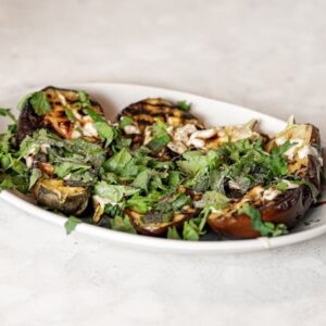 Image of roasted vegetables with garnishes.